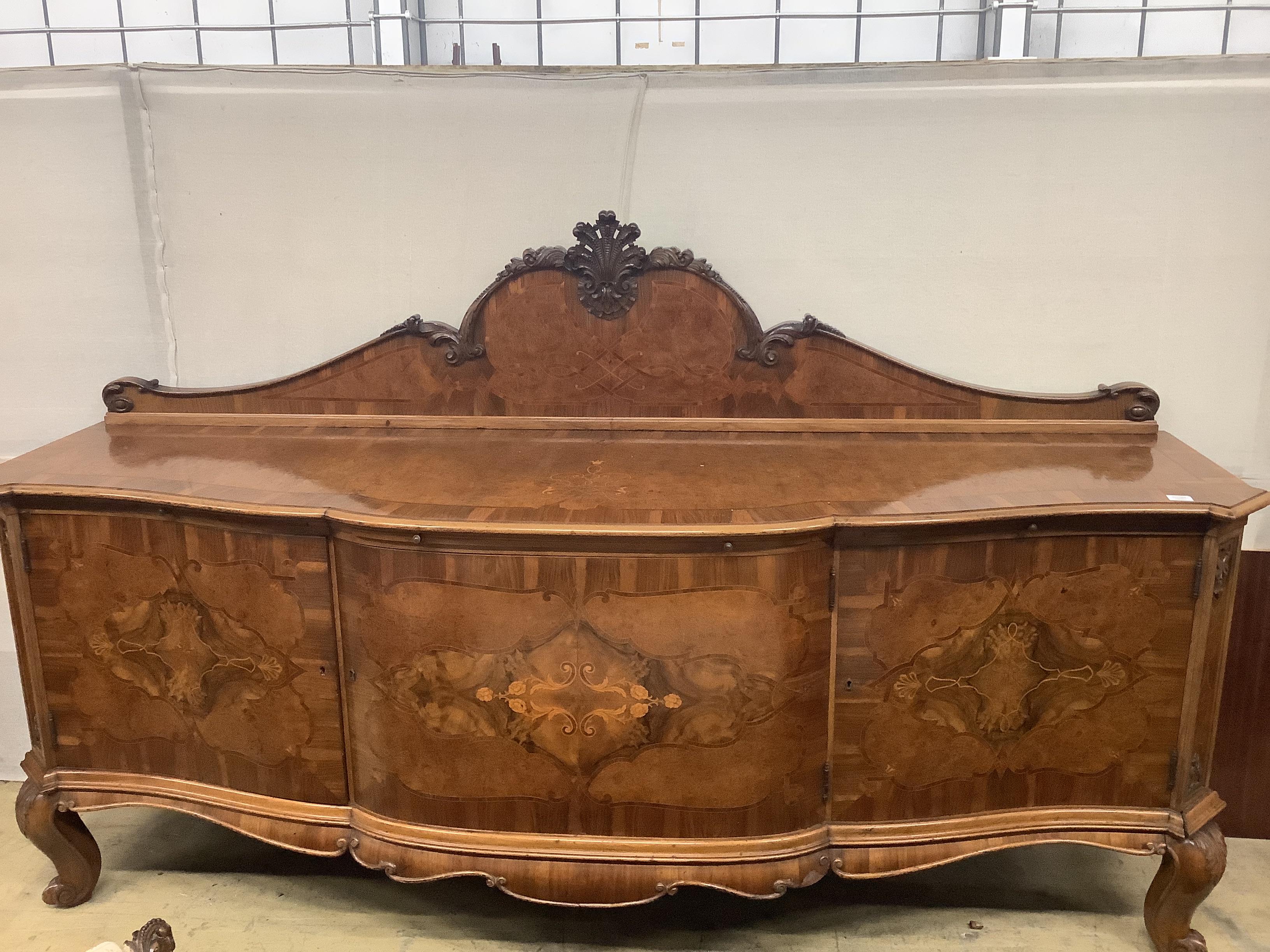 An Austrian marquetry inlaid walnut bow front sideboard, width 252cm, depth 75cm, height 150cm